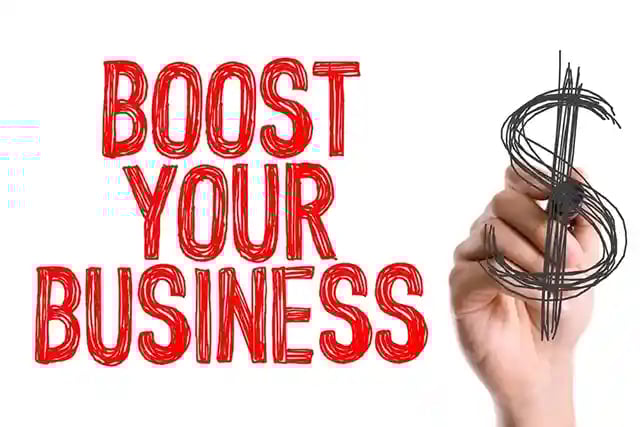 Hand with marker writing Boost Your Business
