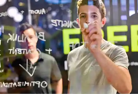 consultant writing on wall