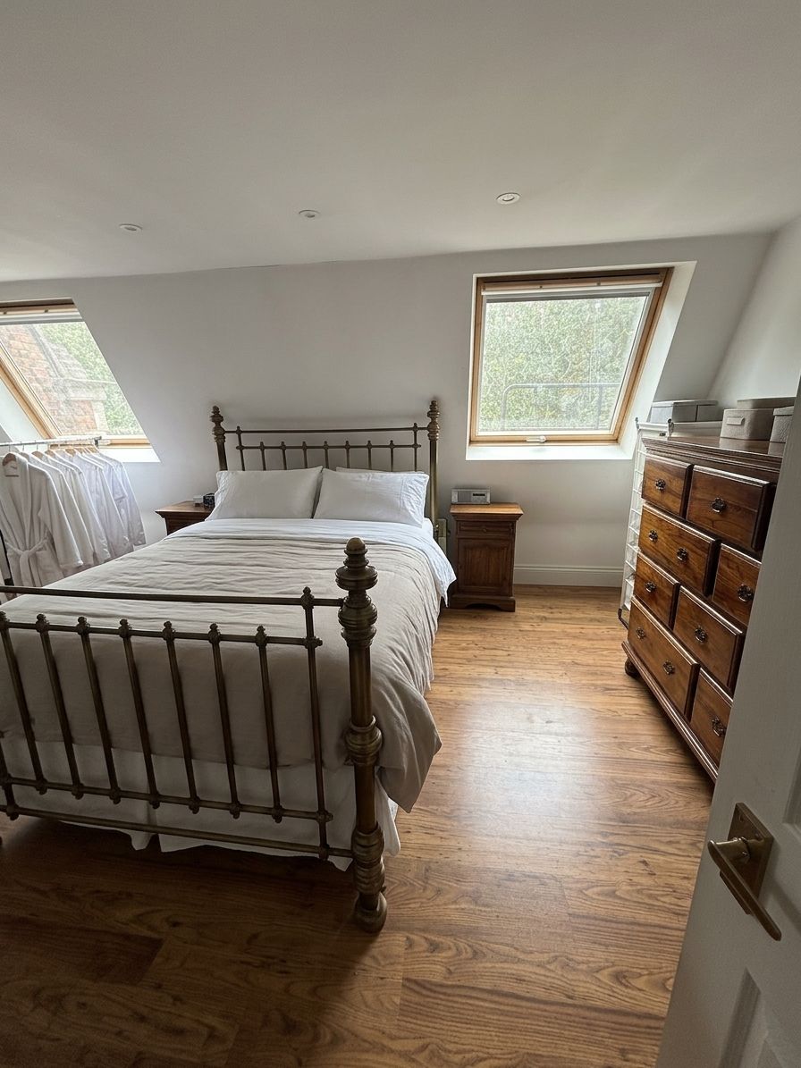 Loft bedroom towards the window (digitally staged)